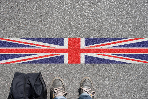 istock A man with a suitcase stands on the border with Great Britain 970241148
