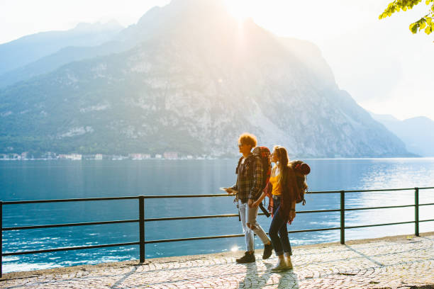 istock Young backpackers walking on the lakeside 970241150