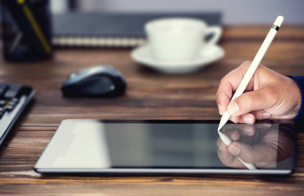 istock Digital Signature Concept with Tablet and Stylus Pen 970241520