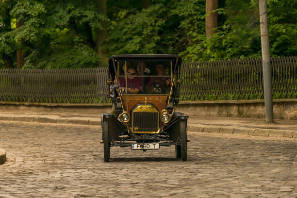 Old retro car Ford T  taking participation in race Lviv, Ukraine - June 3, 2018:Old retro car Ford T its owner and an unknown passenger taking participation in race Leopolis grand prix 2018, Ukraine. model t ford stock pictures, royalty-free photos & images