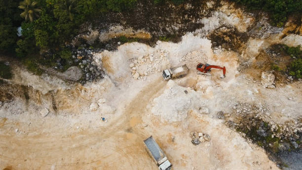 istock Excavator loads truck in quarry. Philippines,Siargao 970249032