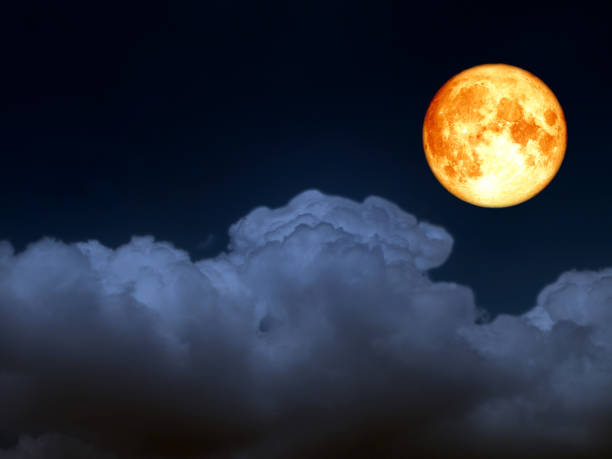 istock full blood moon light blue heap cloud on night sky 970252620
