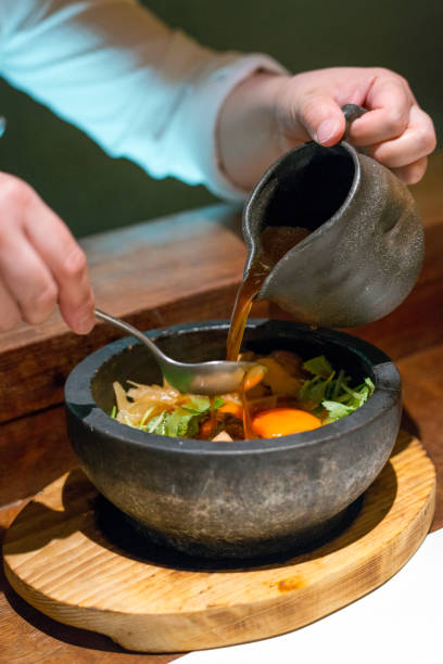 Serving stone pot rice in a restaurant in Japan