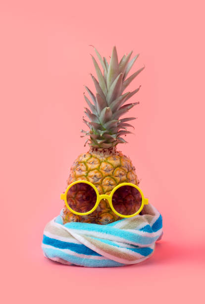 istock A pineapple in a dark mirror on a white background 970267752