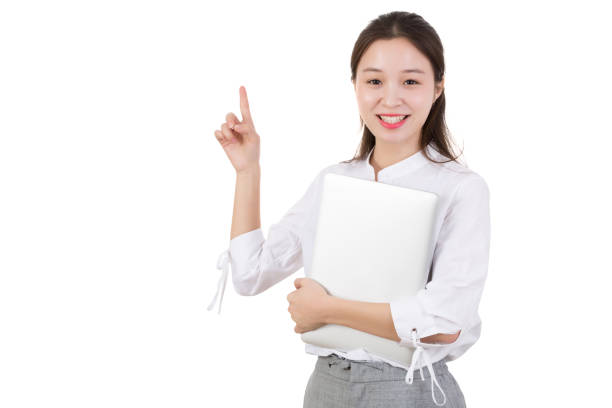 istock Woman Holding Laptop While Pointing Away 970270352