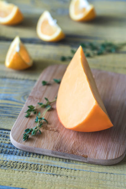 istock Mimolette cheese on the wooden board 970270884