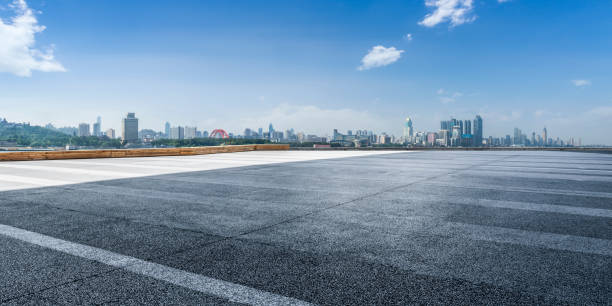 istock Panoramic skyline and modern business office buildings with empty road,empty concrete square floor 970271242
