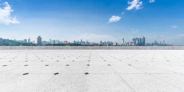 istock Panoramic skyline and modern business office buildings with empty road,empty concrete square floor 970272186