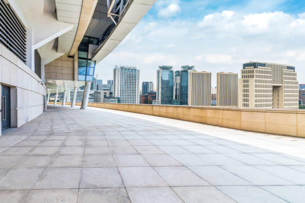 istock Panoramic skyline and modern business office buildings with empty road,empty concrete square floor 970279086
