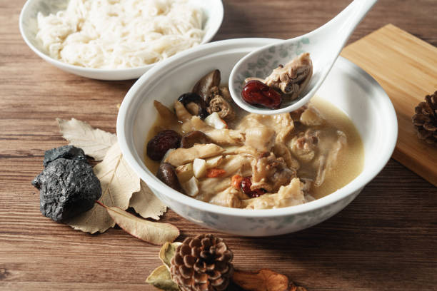 istock A nutritious chicken soup with a woody background 970281314