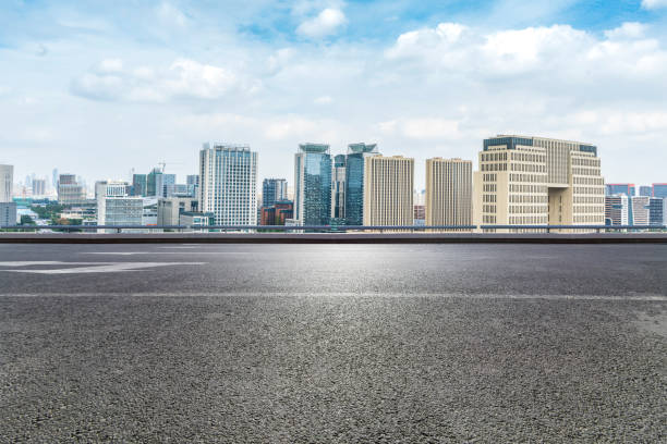 istock Panoramic skyline and modern business office buildings with empty road,empty concrete square floor 970281340
