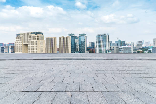 istock Panoramic skyline and modern business office buildings with empty road,empty concrete square floor 970281642