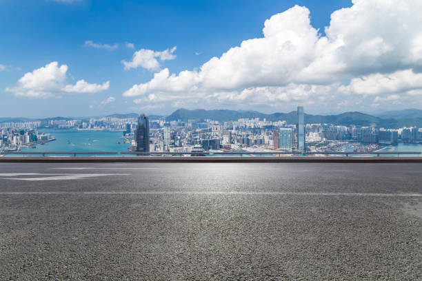 istock Panoramic skyline and modern business office buildings with empty road,empty concrete square floor 970281744