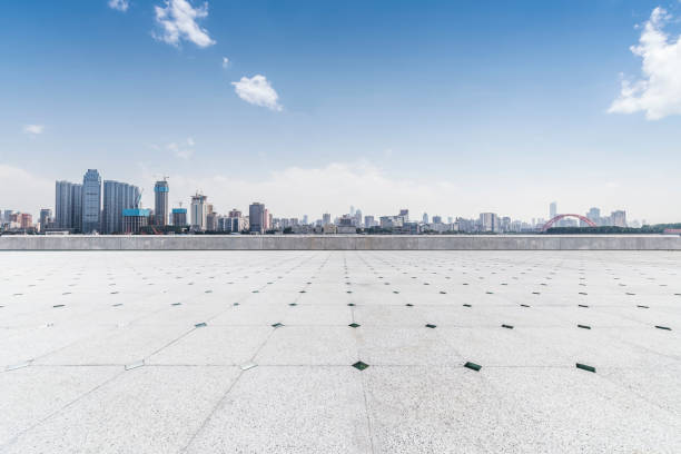 istock Panoramic skyline and modern business office buildings with empty road,empty concrete square floor 970281756