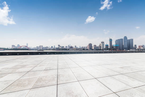 istock Panoramic skyline and modern business office buildings with empty road,empty concrete square floor 970281884