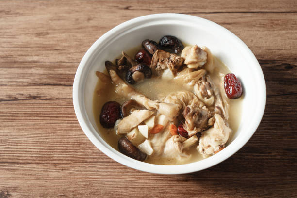 istock A nutritious chicken soup with a woody background 970281918