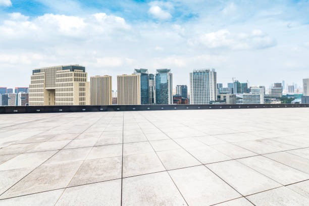 istock Panoramic skyline and modern business office buildings with empty road,empty concrete square floor 970282072