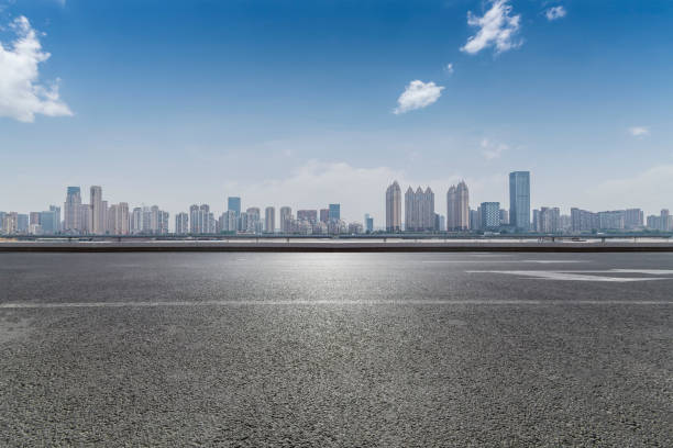 istock Panoramic skyline and modern business office buildings with empty road,empty concrete square floor 970282252