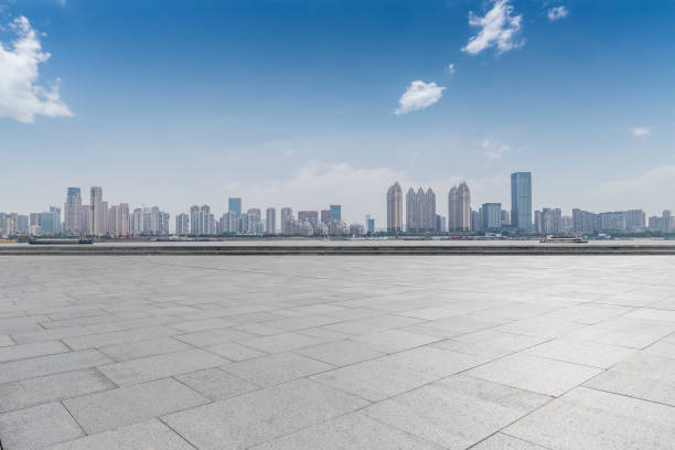 istock Panoramic skyline and modern business office buildings with empty road,empty concrete square floor 970282254