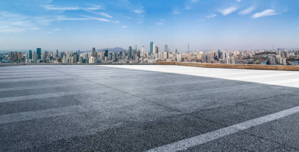 Panoramic skyline and modern business office buildings with empty road,empty concrete square floor