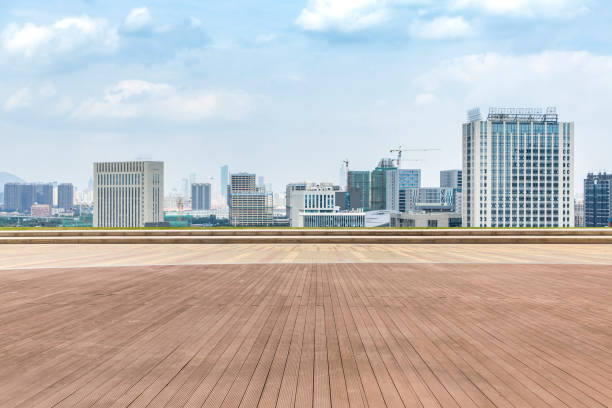 istock Panoramic skyline and modern business office buildings with empty road,empty concrete square floor 970282690