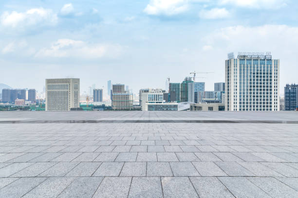 istock Panoramic skyline and modern business office buildings with empty road,empty concrete square floor 970287032