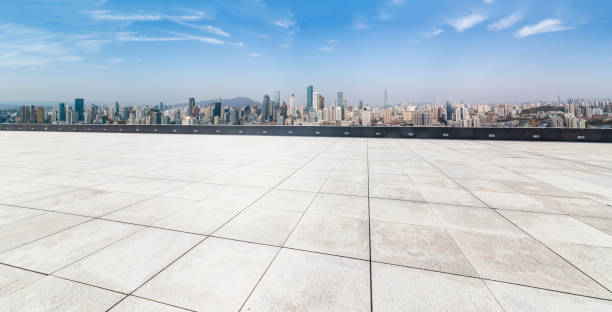 istock Panoramic skyline and modern business office buildings with empty road,empty concrete square floor 970287078