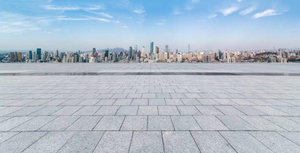 istock Panoramic skyline and modern business office buildings with empty road,empty concrete square floor 970291534