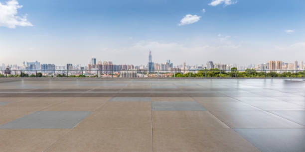 istock Panoramic skyline and modern business office buildings with empty road,empty concrete square floor 970291542