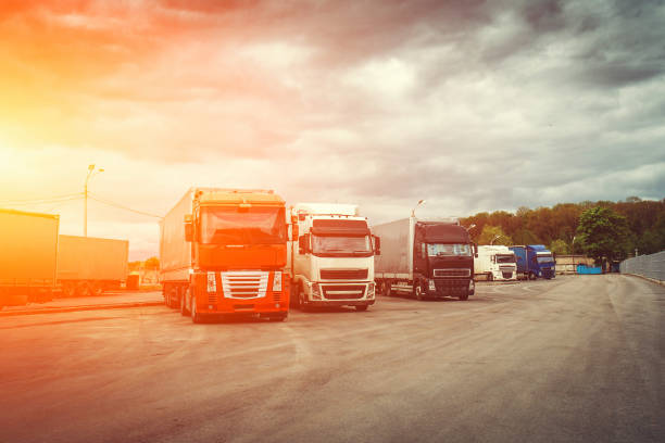 istock Logistic and transport concept, Container trucks for cargo delivery at sunset time, industrial transportation shipping 970291660