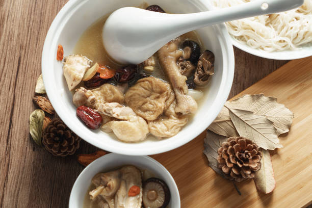 istock A nutritious chicken soup with a woody background 970291888