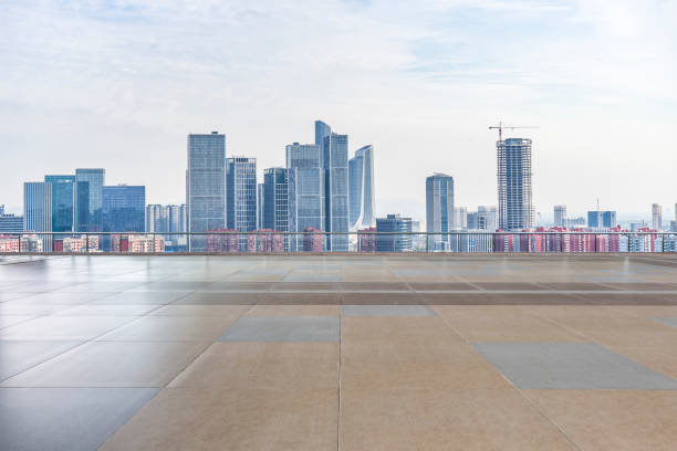 istock Panoramic skyline and modern business office buildings with empty road,empty concrete square floor 970293118