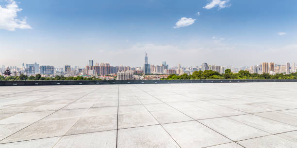 istock Panoramic skyline and modern business office buildings with empty road,empty concrete square floor 970294034