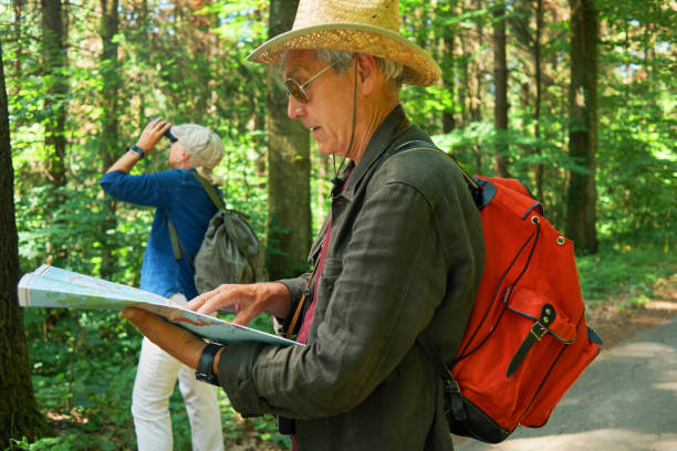 istock active seniors hiking and enjoying the nature 970296290