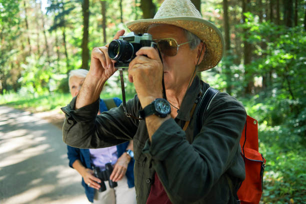 istock active seniors hiking and enjoying the nature 970296332