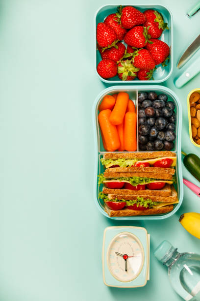 istock Creative flat lay with healthy lunch and office or school supplies 970296508