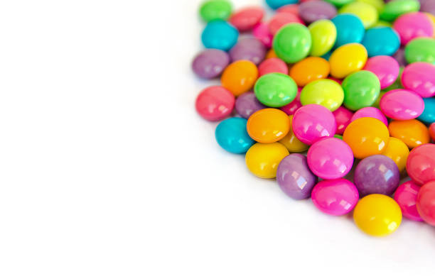 istock colorful chocolate coated candy isolated on white background. with copy space 970303512