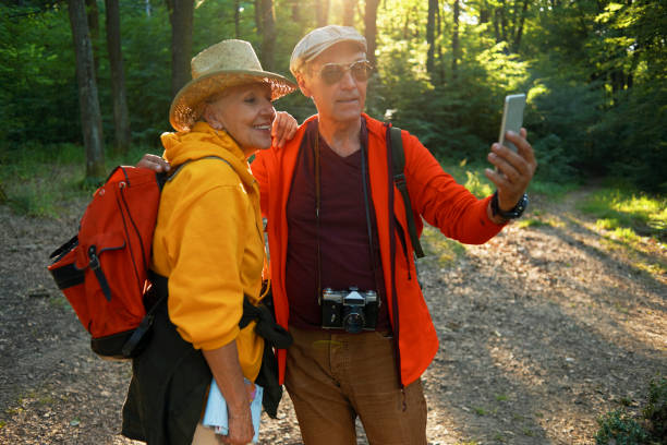 istock seniors hiking and taking a selfie 970303706