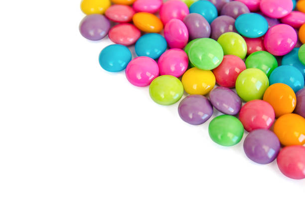 istock colorful chocolate coated candy isolated on white background. with copy space 970304064