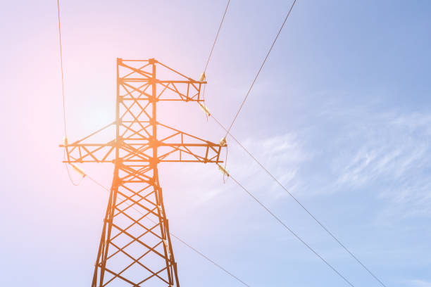 istock High-voltage electricity pylon with blue clear sky on background. Energy transmission 970304572