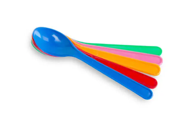 Photo of colorful plastic spoons for party isolated on white with clipping path