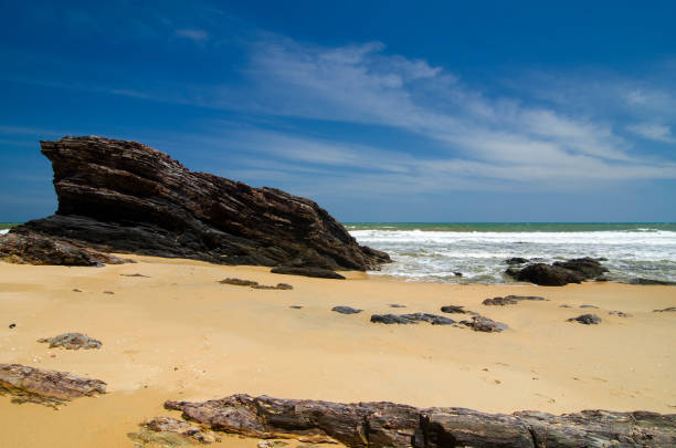 istock Scenic View Of Rocks On Beach Against Sky 970304818
