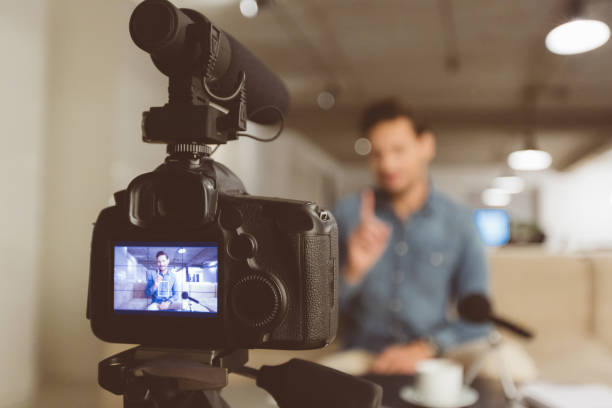istock Male vlogger recording content for his vlog 970320052
