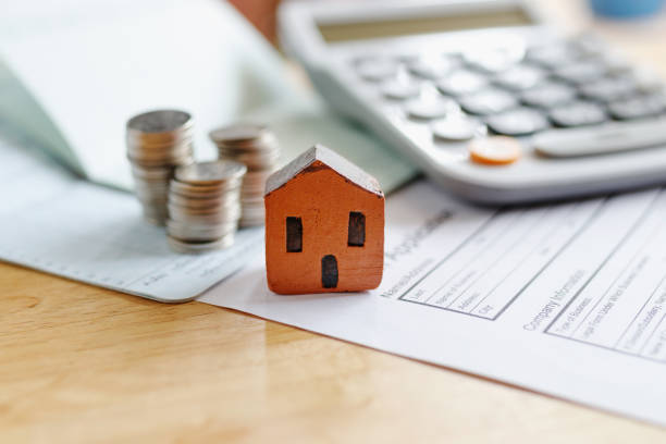 istock Home insurance form with money,passbook  and calculator. 970338336