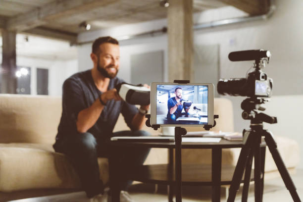istock Vlogger reviewing VR goggles in vlog 970343676