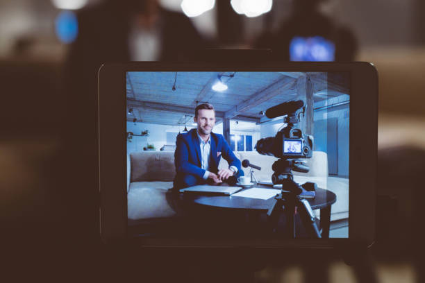 istock Businessman making a video blog in office 970344048