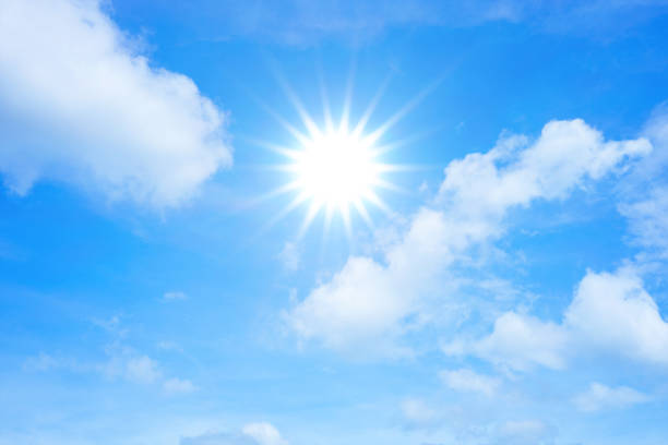 istock Shining sun and white cloud in blue sky 970344916