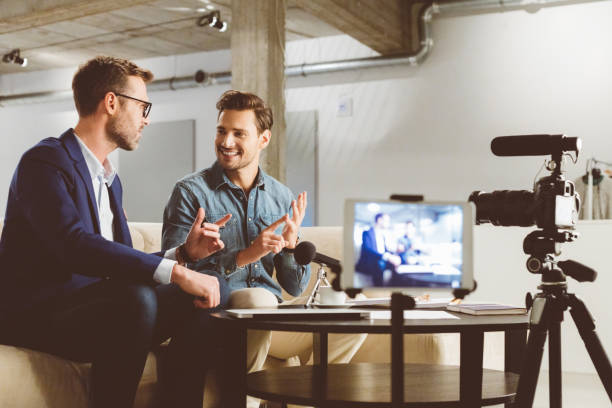 istock Men recording a business vlog on camera 970344928