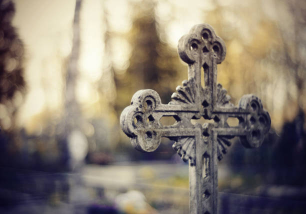 Sepulchral crosses at the cemetery in the evening.