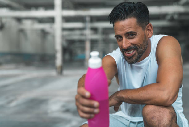istock Athletic Man Resting after Exercising in an Abandoned Warehouse 970367010